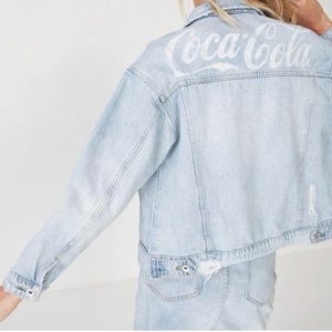 Distressed light wash denim jacket
